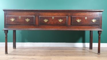 An 18th Century oak Dresser with moulded top above three drawers on turned front supports, 6ft 1in L