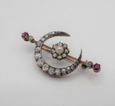 A Victorian Pearl, Diamond and Ruby Crescent and Star Brooch, star having central pearl within old-