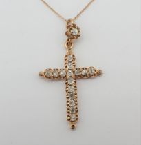 A Diamond Cross set old-cut stones throughout on fine chain, 4cms long, approx 4gms