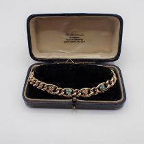 A Victorian curb link Bracelet stamped 9ct, the front with trefoils set seed pearls and turquoise,
