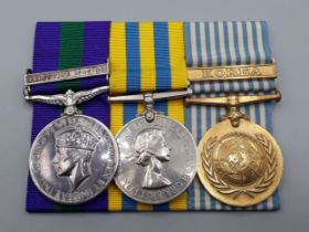 Three; General Service Medal with 'Palestine 1945-48' Clasp, Queen's Korea Medal and UN Korea