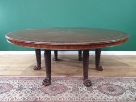 A large Irish mahogany circular Dining Table with crossbanded top, raised on six spiral turned