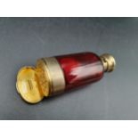 A Victorian silver-gilt mounted red glass Scent Bottle/Vinaigrette with finely scroll pierced and