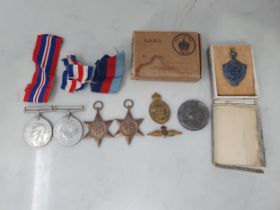 Four; WWII War Medal, Defence Medal, 1939-45 Star, France and Germany Star, with box of issue (