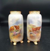 A Pair of Royal Worcester Vases with pierced collars on four scroll feet, signed H Stinton, shape