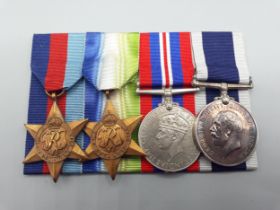Four; WWII 1939-45 Star, Atlantic Star, War Medal and Royal Navy Long Service and Good Conduct Medal