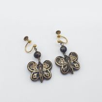 A pair of Piqué Butterfly Earrings on screw fittings