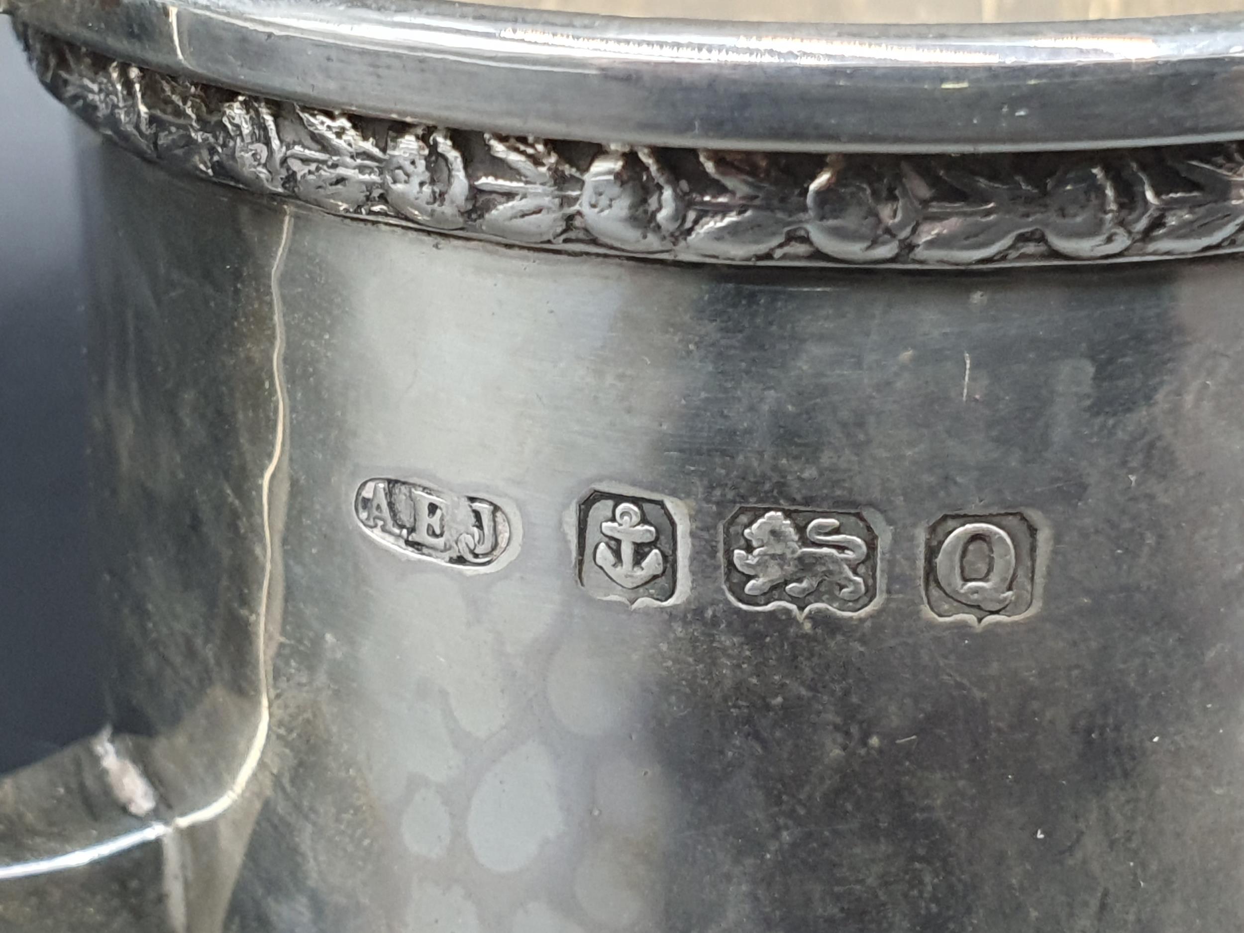 A George VI heavy silver Milk Jug with leafage frieze and hammered design on four shaped feet, - Image 2 of 3