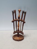 A set of antique treen Tools with bulldog head handles within turned wooden Stand 8 1/2in H