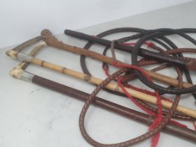 A Hunting Whip with antler handle and plaited leather shaft and thong, the steel collar engraved '