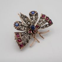 A Sapphire, Ruby, Pearl and Diamond Butterfly Brooch with round sapphire and seed pearls to body and