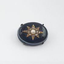 A Victorian ringed Agate Mourning Brooch applied star set seed pearl within rose-cut diamonds,