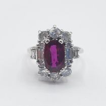 An Art Deco style Ruby and Diamond Cluster Ring corner claw-set rectangular cushion-cut ruby, approx