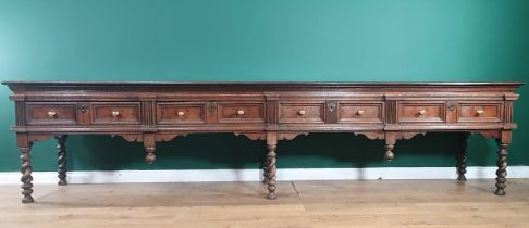 A large and impressive 17th Century oak Dresser Base with moulded top, above four recessed moulded