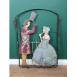 An antique Folk Art Pub Sign with carved figures of a Gentleman and Lady A/F within a metal frame