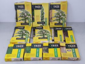 Eleven boxed Britains Trees including 3x 1824 Cedar, 1820 Poplar, 3x 1801 Apple Tree, 1814 Date