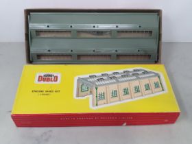 A boxed Hornby Dublo 5005 Engine Shed, mint with no parts spot glued in place. Box in Ex plus