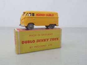 A boxed Dublo Dinky Toys 071 grey Volkswagen Delivery Van, mint. The van has the rarer grey wheels