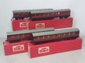 Two boxed Hornby Dublo 4083 BR Suburban Coaches and two boxed 4084 Suburban Coaches, Nr M-M. Coaches