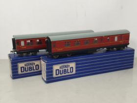 Two boxed Hornby Dublo D22 Corridor Coaches with metal wheels, mint. Both coaches are in mint