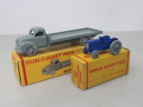 A boxed Dublo Dinky Toys 066 Bedford Flat Truck and 069 Tractor, mint. Both vehicles in mint