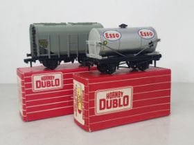 A boxed Hornby Dublo Export 4825 Bulk Grain Wagon and a boxed Export 4876 'Esso' Tank Wagon, unused.