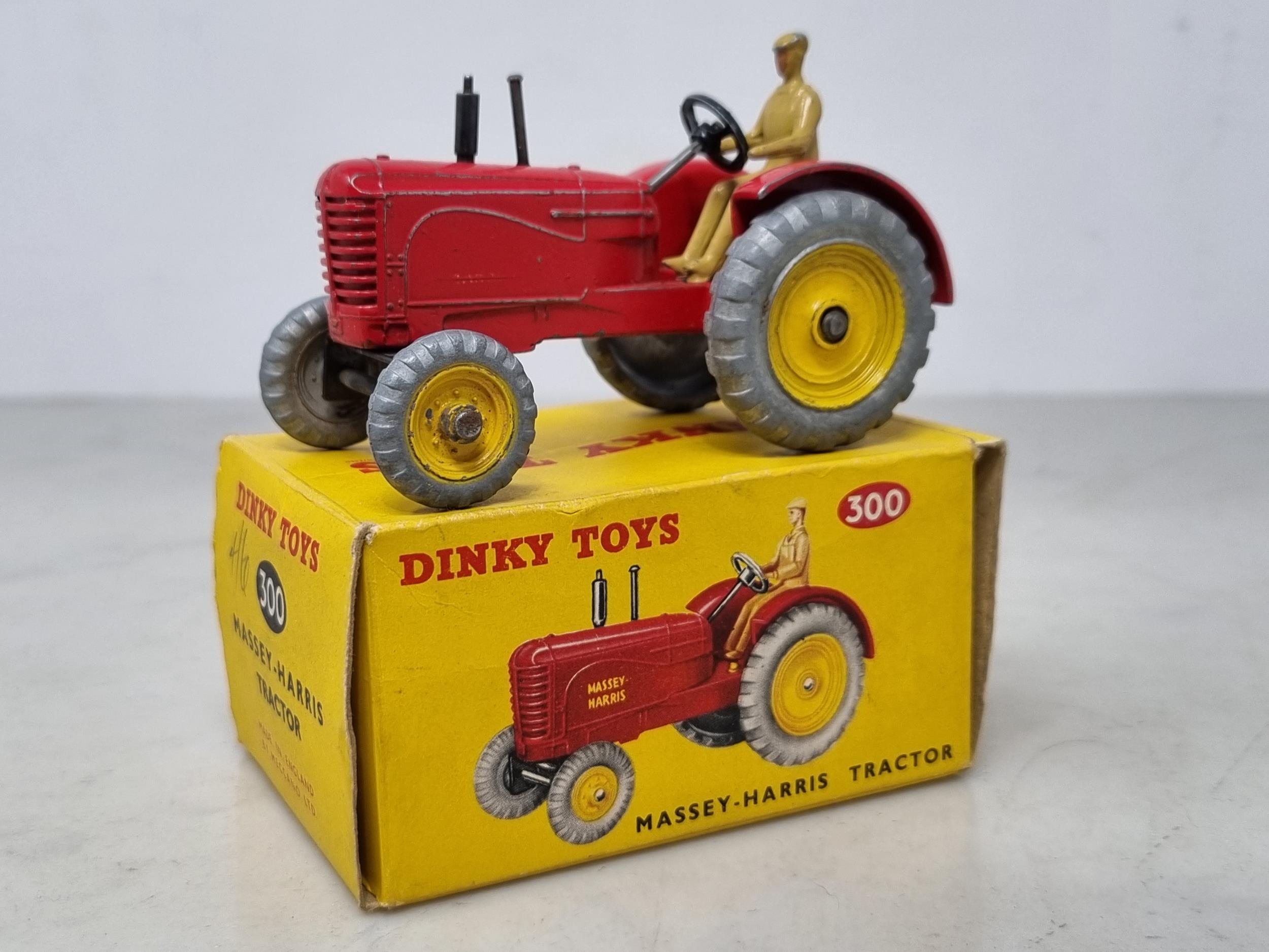 A boxed Dinky Toys No.300 Massey-Harris Tractor, G (transfers heavily worn), box Ex