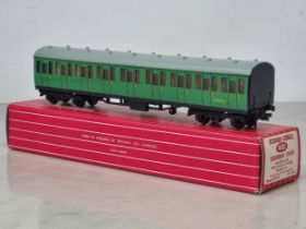 A boxed Hornby Dublo 4081 S.R. Suburban Coach in mint condition and showing no signs of use to the