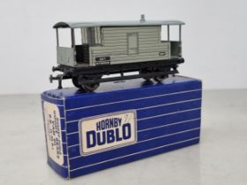 A rare boxed Hornby Dublo long wheel base L.M.R. Brake Van in mint condition. These brake vans use