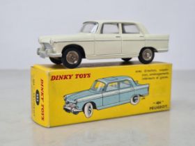 A boxed French Dinky Toys No.553 cream Peugeot 404, Nr M, box Ex plus