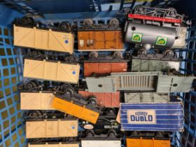 Two trays containing twenty unboxed Hornby Dublo and Trix Wagons and a S.R. Suburban Trailer Coach