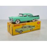 A boxed Dinky Toys No.191 green Dodge Royal Sedan, Ex (one tyre flat), box VG