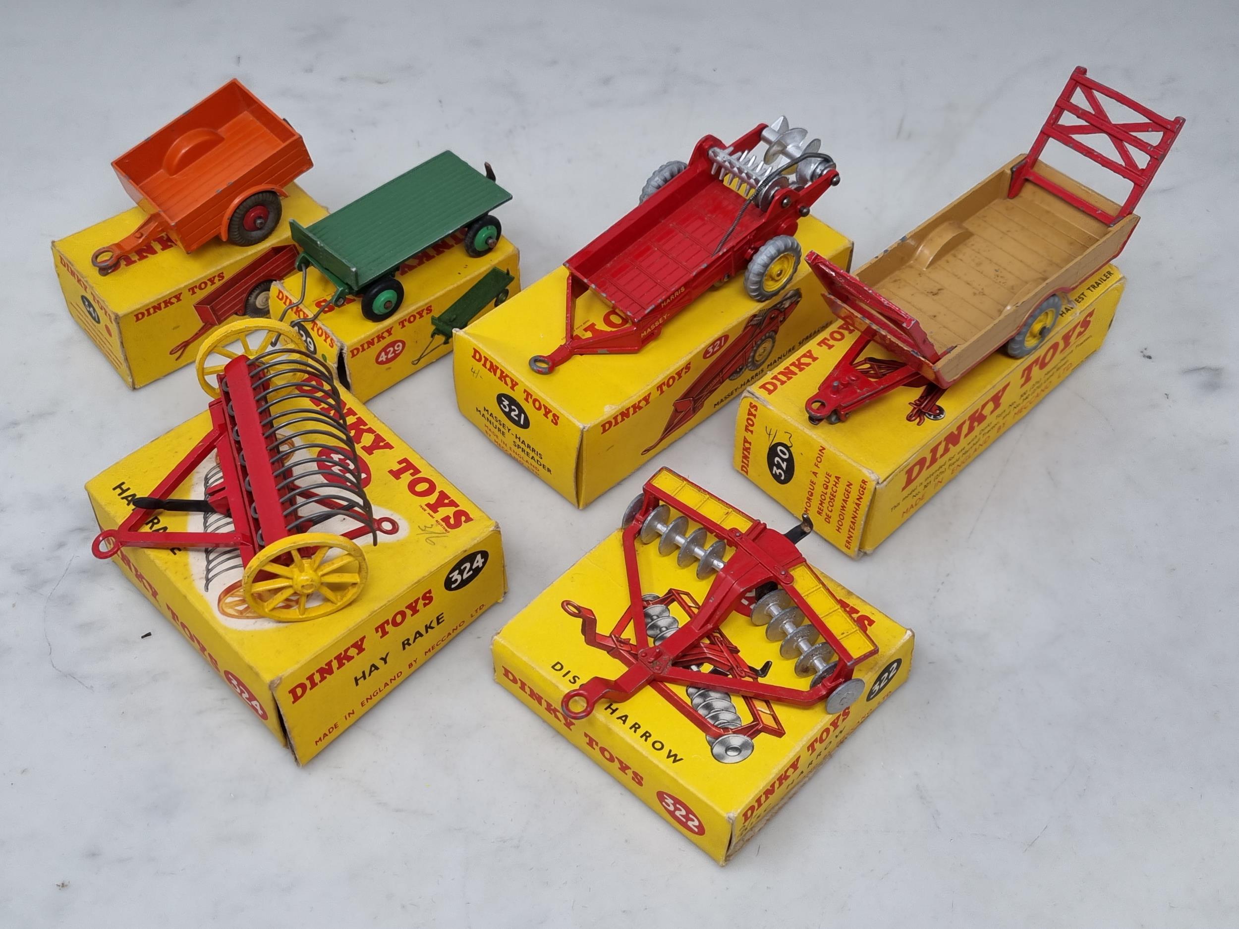 Six boxed Dinky Toys Farm Implements including No.320 Harvest Trailer, No.321 Massey-Harris Manure