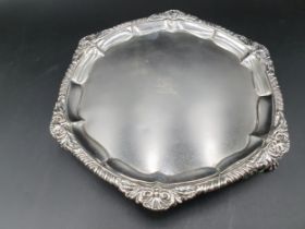 A George IV silver Waiter of circular form with gadroon and scallop rim, engraved crest on scroll