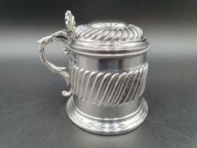 A Victorian silver large Mustard Pot with gadroon embossing, scallop thumb piece, blue glass