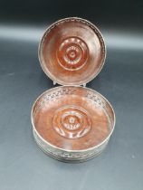 A pair of George III silver pierced circular Coasters with bright cut foliate frieze, reeded rims,