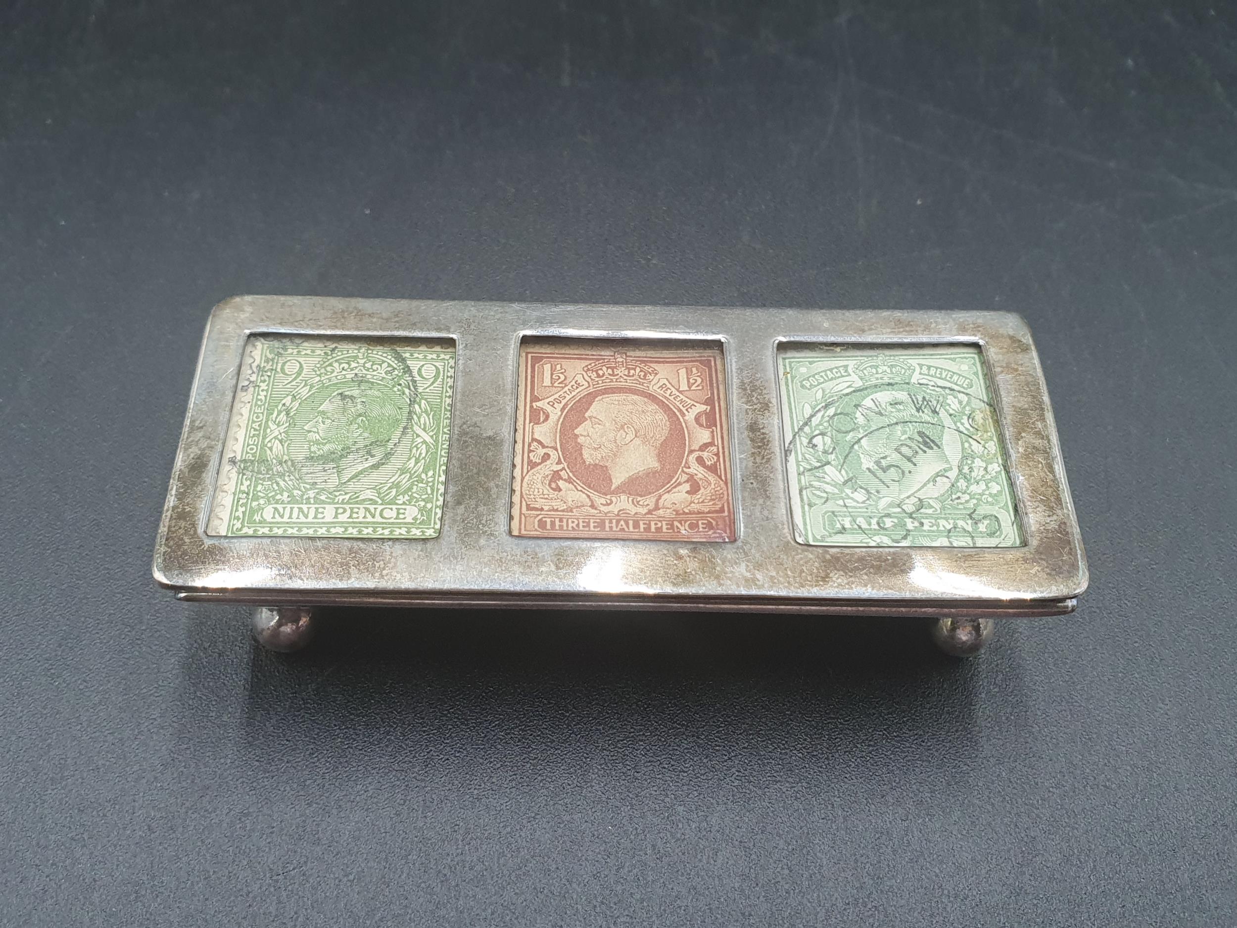 An Edward VII silver three division Stamp Box on ball feet, Birmingham 1904