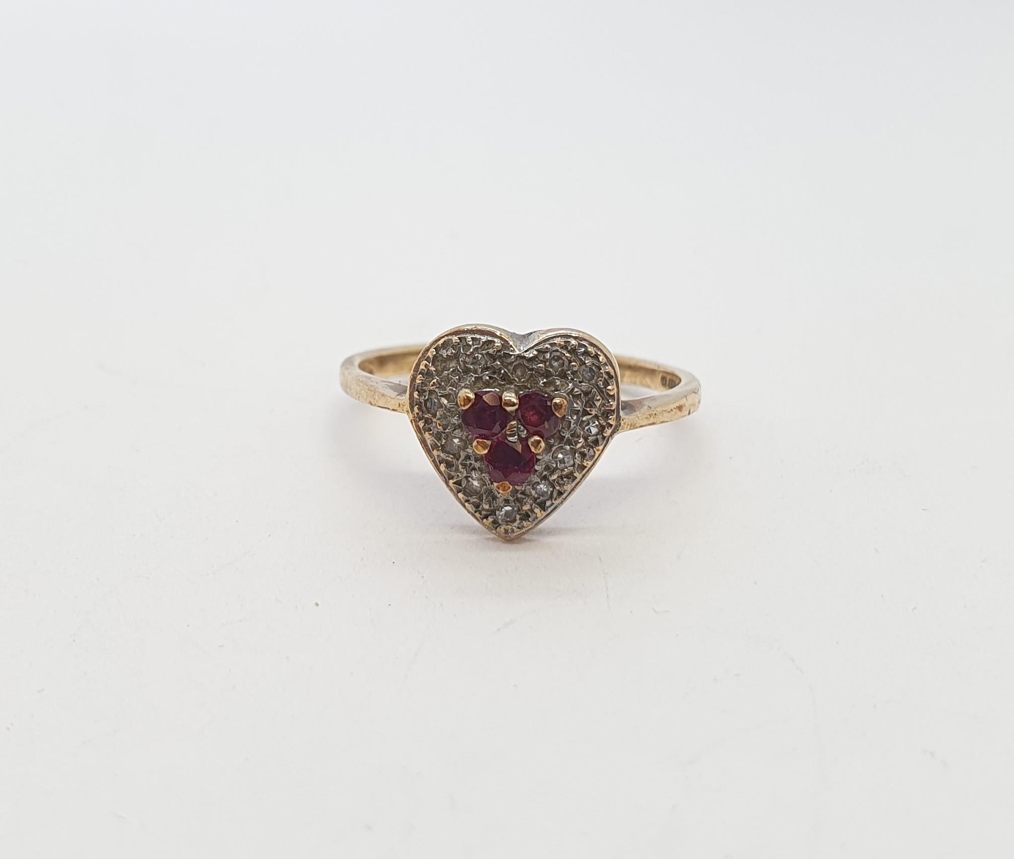 A Heart-shaped Ring peg-set rubies and diamonds in 9ct gold, ring size P, approx 2.3gms