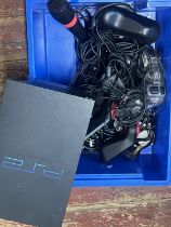 A PS2 console and accessories