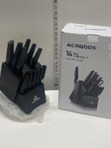 A boxed Acoqoos knife block over18's