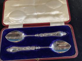 A set of two cased electroplated spoons with diamond etching design