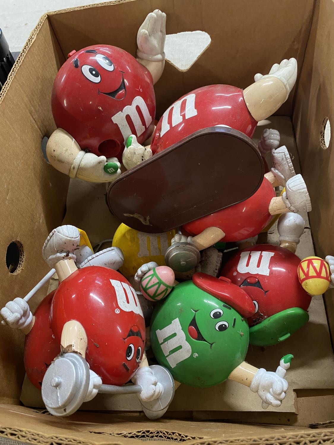 A box of assorted M&M advertising toys