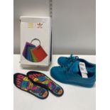 A new boxed with tags pair of Adidas supercolor trainers. Size 8.5