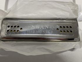 A boxed Swan harmonica