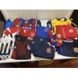 A job lot of mixed football shirts