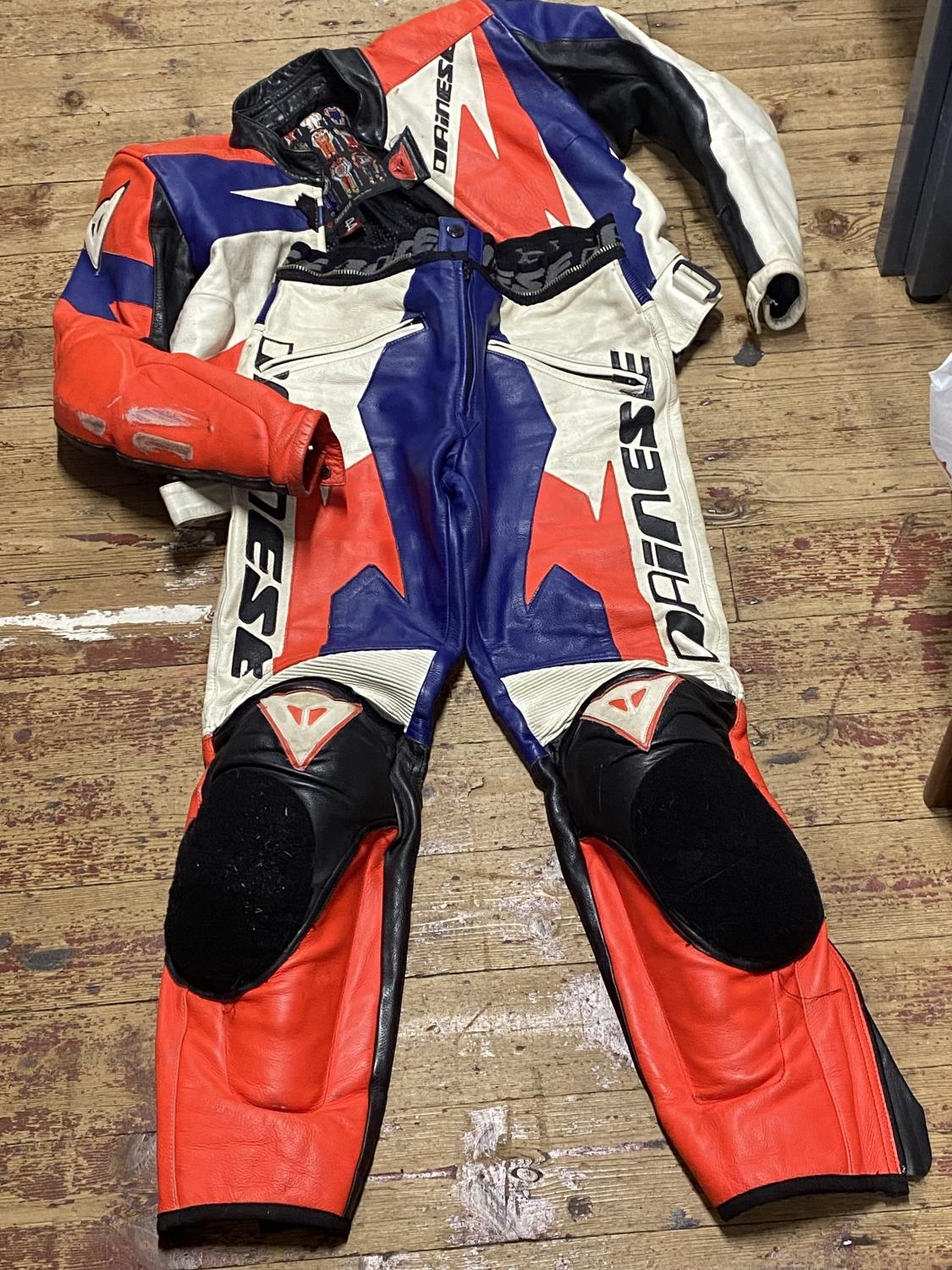 A set of Dainese motorcycle leathers worn