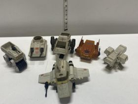 A box full of assorted Star Wars mini rigs toys