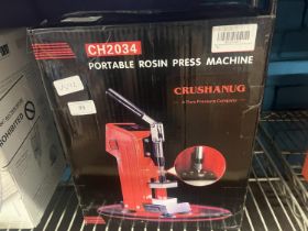 A boxed rosin press machine (untested)