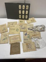 A job lot of complete cigarette card albums and loose cards