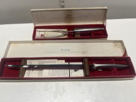Two boxed Gerber carving sets